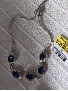 Elegant Silver Bracelet with Deep Blue Teardrop Stones by